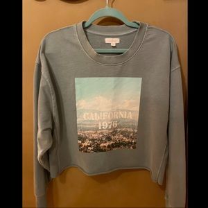 cropped sweatshirt, brand is colsie. Size XL. Light blue color.
